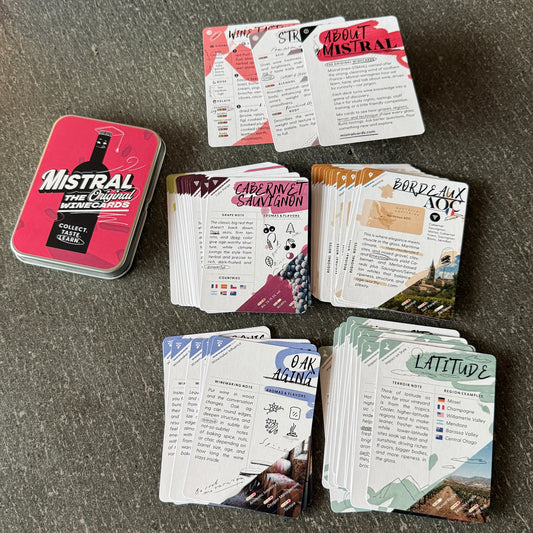 Collection of Mistral WineCards with various card types including core tools, grapes, regtions, terroir, and winemaking on a dark surface