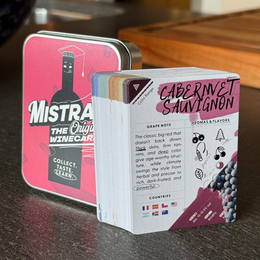 Deck ONE counter display featuring a red Mistral WineCards tin and card deck on a clean, neutral background.
