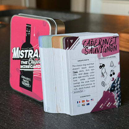 Stack of Mistral WineCards playing cards with visible branding on a dark surface